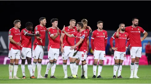 Luke Young of Wrexham celebrates with team mates
