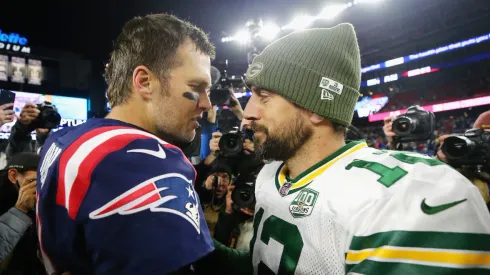 Tom Brady with Aaron Rodgers after an NFL 2018 game between the New England Patriots and the Green Bay Packers
