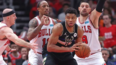 Giannis Antetokounmpo #34 of the Milwaukee Bucks looks to move against (L-R) Alex Caruso #6, DeMar DeRozan #11 and Nikola Vucevic #9 of the Chicago Bulls