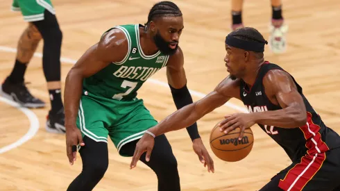 Jaylen Brown #7 of the Boston Celtics defends Jimmy Butler #22 of the Miami Heat
