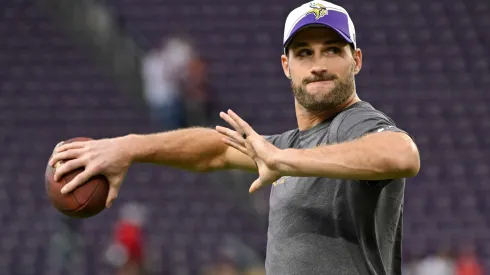 Kirk Cousins of the Minnesota Vikings throwing a football in practice