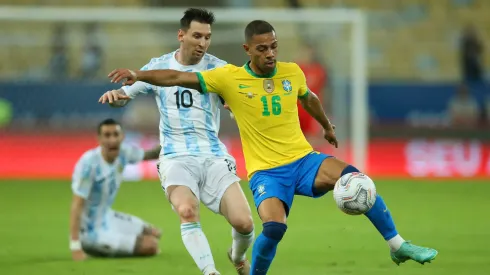 Renan Lodi of Brazil fights for the ball with Lionel Messi of Argentina during the Copa America final in 2021.
