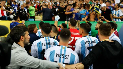 Lionel Messi trying to calm down the situation at Maracana Stadium.