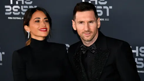 Antonela Roccuzzo and Lionel Messi pose for a photo on the Green Carpet ahead of The Best FIFA Football Awards 2022 on February 27, 2023 in Paris, France.