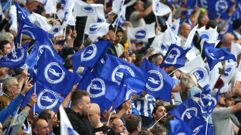 Brighton and Hove Albion fans wave flags as they show their support prior to the Premier League match between Brighton & Hove Albion and Watford at American Express Community Stadium on August 21, 2021 in Brighton, England. (Photo by Steve Bardens/Getty Images)
