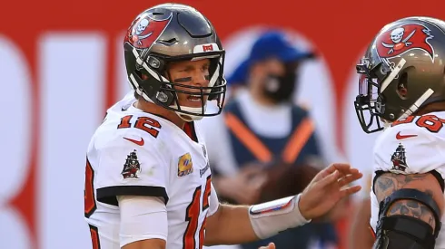 Tom Brady #12 celebrates with Ryan Jensen #66 of the Tampa Bay Buccaneers after a touchdown pass against the Green Bay Packers during the second quarter at Raymond James Stadium on October 18, 2020 in Tampa, Florida.
