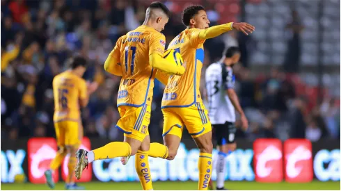 Ozziel Herrera of Tigres celebrates with teammates after scoring 
