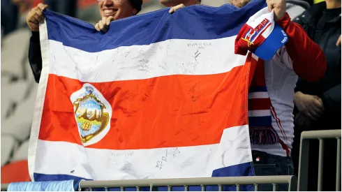 Costa Rican fans hold their contry's flag
