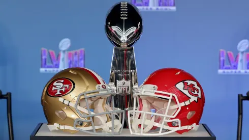 The Vince Lombardi trophy with a San Francisco 49ers and Kansas City Chiefs helmet for Super Bowl LVIII
