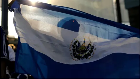 El Salvador fan waves a flag
