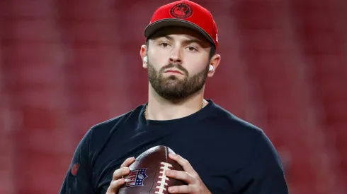 Baker Mayfield looks on before a game.
