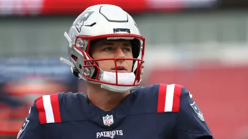 Mac Jones #10 of the New England Patriots looks on before the game against the Kansas City Chiefs at Gillette Stadium on December 17, 2023 in Foxborough, Massachusetts.
