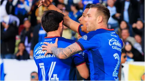 Angel Sepulveda of Cruz Azul is congratulated by teammates