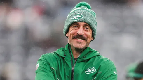 Aaron Rodgers shares a laugh with one of his teammates during warm-ups at Met Life Stadium.
