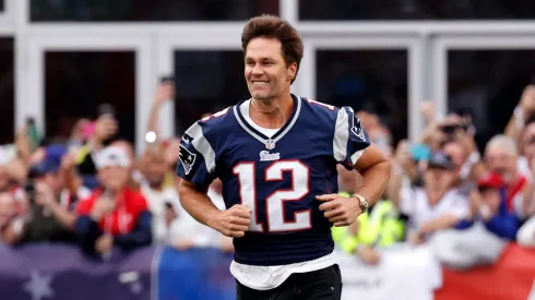 Tom Brady running at Gillette Stadium.
