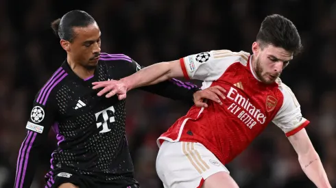 Declan Rice of Arsenal holds off Leroy Sane of Bayern Munich during the UEFA Champions League quarter-final first leg match between Arsenal FC and FC Bayern München at Emirates Stadium on April 09, 2024 in London, England.
