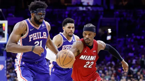 Jimmy Butler #22 of the Miami Heat dribbles against Joel Embiid #21 of the Philadelphia 76ers during the second half in Game Six of the 2022 NBA Playoffs Eastern Conference Semifinals at Wells Fargo Center on May 12, 2022 in Philadelphia, Pennsylvania.
