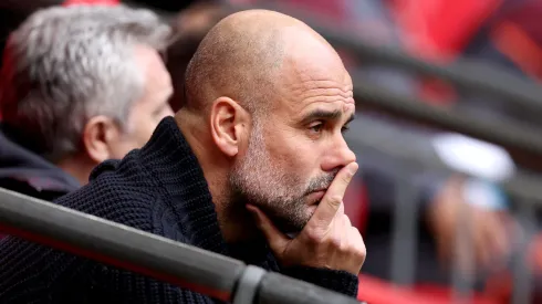 Pep Guardiola, Manager of Manchester City, looks on prior to the Emirates FA Cup Semi Final match between Manchester City and Chelsea at Wembley Stadium on April 20, 2024 in London, England.
