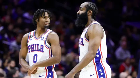 Tyrese Maxey #0 and James Harden #1 of the Philadelphia 76ers look on during the fourth quarter against the Cleveland Cavaliers at Wells Fargo Center on February 15, 2023 in Philadelphia, Pennsylvania.

