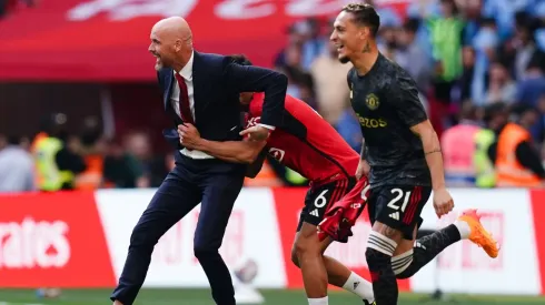 Manchester United manager Erik ten Hag (left) celebrates with Lisandro Martinez after winning the Emirates FA Cup final at Wembley Stadium
