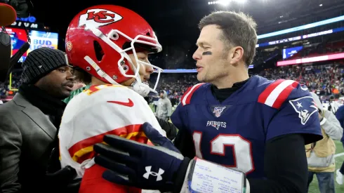 Tom Brady #12 of the New England Patriots talks with Patrick Mahomes #15 of the Kansas City Chiefs after the Chief defeat the Patriots 23-16 at Gillette Stadium on December 08, 2019 in Foxborough, Massachusetts.
