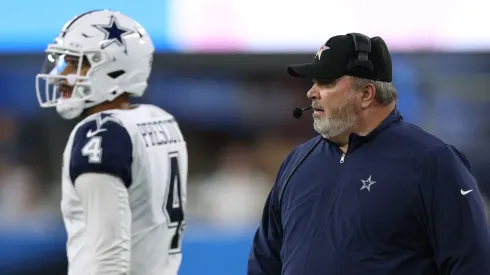 Mike McCarthy and Dak Prescott #4 of the Dallas Cowboys wait for a call during a 20-17 win over the Los Angeles Chargers at SoFi Stadium on October 16, 2023 in Inglewood, California.
