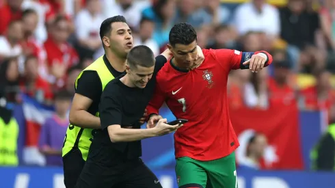 Cristiano Ronaldo with a fan during Portugal vs Turkey in UEFA Euro 2024