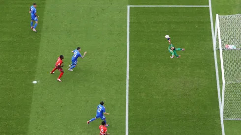 Image was captured using a remote camera positioned above the field of play) Gianluigi Donnarumma of Italy fails to save a shot from Ruben Vargas of Switzerland.