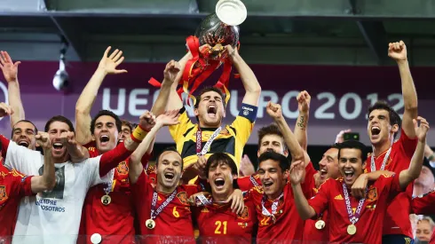 Iker Casillas (C) of Spain lifts the trophy as he celebrates with team-mates following victory in the UEFA EURO 2012 final match between Spain and Italy

