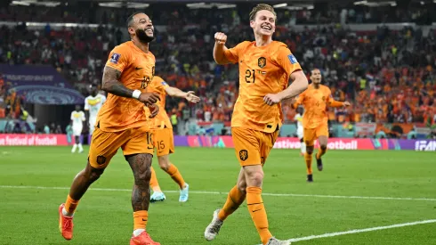 Memphis Depay (L) and Frenkie de Jong of Netherlands celebrate their team's second goal by Davy Klaassen during the FIFA World Cup Qatar 2022