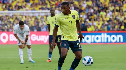 Pervis Estupiñan of Ecuador controls the ball during a FIFA World Cup 2026 Qualifier match between Ecuador and Uruguay.
