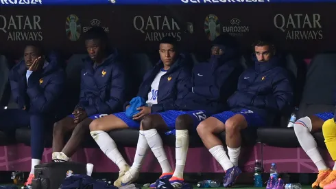 Kylian Mbappe of France sits on the bench after being substituted during the UEFA EURO 2024 quarter-final match between Portugal and France.
