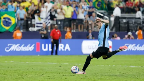 Federico Valverde of Uruguay scores the team's first penalty in the penalty shoot out during the CONMEBOL Copa America 2024 quarter-final match between Uruguay and Brazil.
