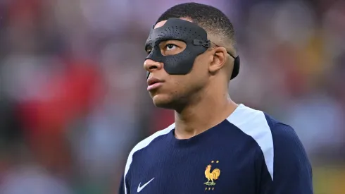 France player Kylian Mbappe in his mask looks on before the UEFA EURO 2024 quarter-final match between Portugal and France.