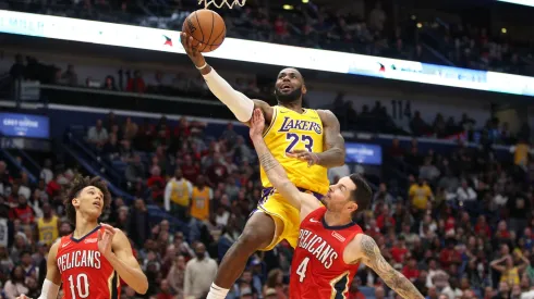 LeBron James #23 of the Los Angeles Lakers shoots the ball over JJ Redick #4 of the New Orleans Pelicans at Smoothie King Center on November 27, 2019.
