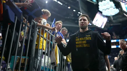 Klay Thompson #11 of the Golden State Warriors leaves the court after warming up prior to the game against the Charlotte Hornets at Spectrum Center on March 29, 2024 in Charlotte, North Carolina.

