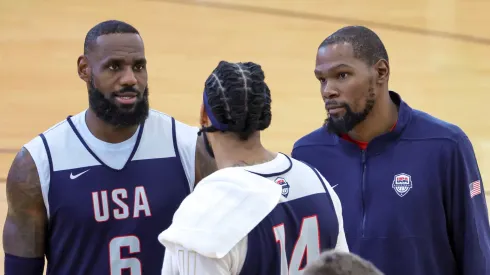LeBron James #6, Anthony Davis #14 and Kevin Durant #7 of the 2024 USA Basketball Men's National Team talk during a practice session at the team's training camp at the Mendenhall Center at UNLV on July 07, 2024 in Las Vegas, Nevada. 
