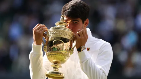 Carlos Alcaraz of Spain kisses the Gentlemen's Singles Trophy following victory against Novak Djokovic of Serbia in the Gentlemen's Singles Final during day fourteen of The Championships Wimbledon 2024 at All England Lawn Tennis and Croquet Club on July 14, 2024 in London, England.
