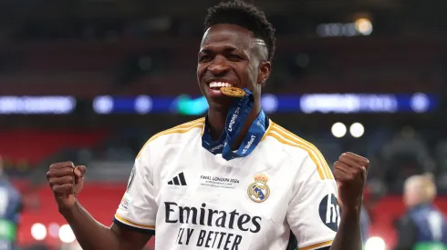 Vinicius Junior of Real Madrid bites his winners medal following victory in the UEFA Champions League 2023/24 Final match between Borussia Dortmund and Real Madrid CF.