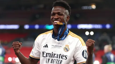 Vinicius Junior of Real Madrid bites his winners medal following victory in the UEFA Champions League 2023/24 Final match between Borussia Dortmund and Real Madrid CF.
