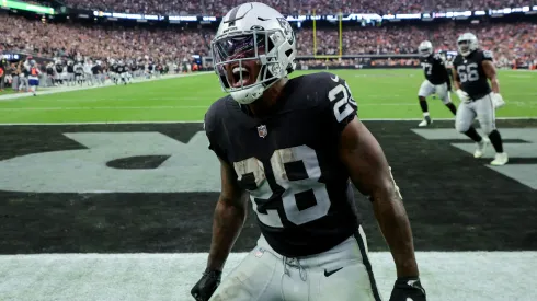 Josh Jacobs #28 of the Las Vegas Raiders celebrates after scoring a touchdown in the fourth quarter against the Denver Broncos at Allegiant Stadium on October 02, 2022 in Las Vegas, Nevada.