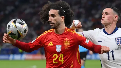 Marc Cucurella of Spain attempts to control the ball whilst under pressure from Phil Foden of England during the UEFA EURO 2024 final match between Spain and England at Olympiastadion on July 14, 2024 in Berlin, Germany.
