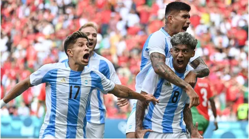 Argentine players celebrate after scoring
