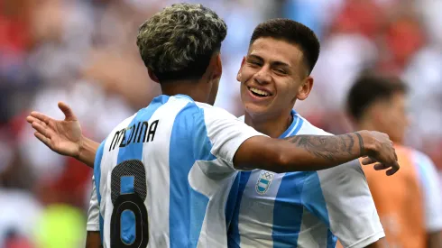 Claudio Echeverri #11 of Team Argentina interacts with Cristian Medina #8 of Team Argentina during the Men's group B match between Argentina and Morocco