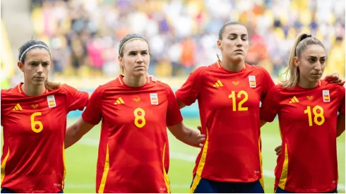 Players of Spain are seen during the national anthem
