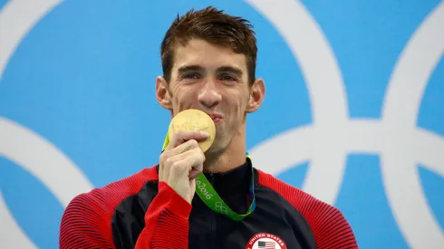 Gold medalist Michael Phelps of the United States celebrates on the podium during the medal ceremony for the Men's 200m Individual Medley Final of the Rio 2016 Olympic Games.
