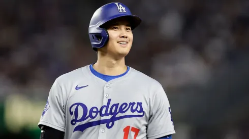 Shohei Ohtani #17 of the Los Angeles Dodgers smiles from first base during the eighth inning against the New York Yankees at Yankee Stadium on June 08, 2024 in New York City.