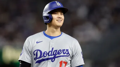 Shohei Ohtani #17 of the Los Angeles Dodgers smiles from first base during the eighth inning against the New York Yankees at Yankee Stadium on June 08, 2024 in New York City. 
