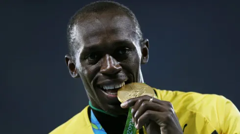 Gold medalist Usain Bolt of Jamaica stands on the podium during the medal ceremony for the Men's 4 x 100 meter Relay on Day 15 of the Rio 2016 Olympic Games at the Olympic Stadium on August 20, 2016 in Rio de Janeiro, Brazil. 
