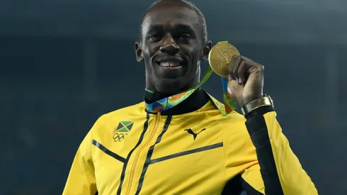 Gold medalist, Usain Bolt of Jamaica, poses on the podium during the medal ceremony for the Mens 200m on Day 14 of the Rio 2016 Olympic Games at the Olympic Stadium on August 19, 2016 in Rio de Janeiro, Brazil.